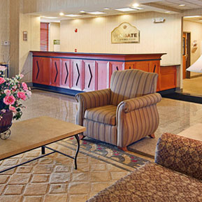 Wingate main lobby red reception desk and lounge area